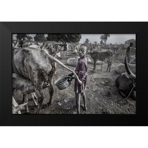 Mundari Child Filling The Container With Cow Urine - South Sudan Black Modern Wood Framed Art Print by Inazio Kuesta, Joxe