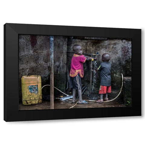 Surmi Tribe Children Cleaning Their Hands Before Starting To Eat - Ethiopia Black Modern Wood Framed Art Print by Inazio Kuesta, Joxe