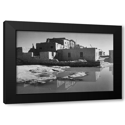 Adobe House with Water in Foreground - Acoma Pueblo, New Mexico - National Parks and Monuments, ca.  Black Modern Wood Framed Art Print by Adams, Ansel