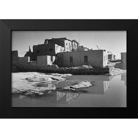 Adobe House with Water in Foreground - Acoma Pueblo, New Mexico - National Parks and Monuments, ca.  Black Modern Wood Framed Art Print by Adams, Ansel