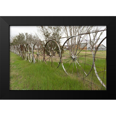 A fence made of wagon wheels near Schulenburg in Fayette County, TX Black Modern Wood Framed Art Print by Highmith, Carol