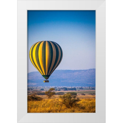 A hot-air balloon slowly traverses over the Serengeti plain White Modern Wood Framed Art Print by Richardson, Larry
