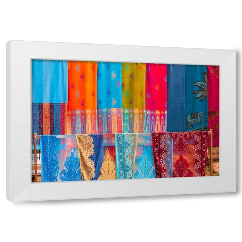 Laos- Luang Prabang. Colorful textiles- possibly scarves- for sale. White Modern Wood Framed Art Print by Haseltine, Tom