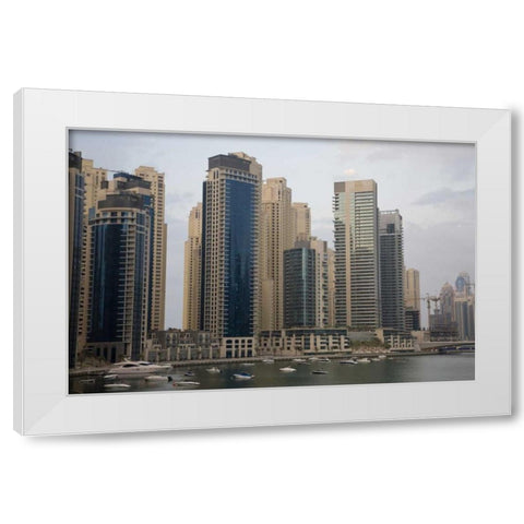 UAE, Dubai Modern buildings tower over boats White Modern Wood Framed Art Print by Young, Bill