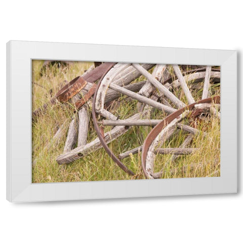 Canada, BC, Fort Steele Wagon wheels in grass White Modern Wood Framed Art Print by Paulson, Don