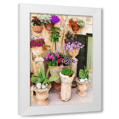 Italy-Apulia-Metropolitan City of Bari-Monopoli Flowers in planters outside a stone building White Modern Wood Framed Art Print by Wilson, Emily