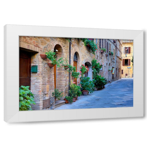 Italy-Tuscany-Pienza Flower pots and potted plants decorate a narrow street in a Tuscany village White Modern Wood Framed Art Print by Eggers, Julie