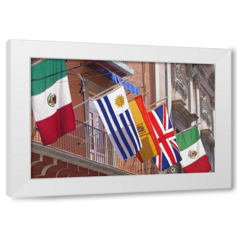 Mexico, Guanajuato Flags displayed from balcony White Modern Wood Framed Art Print by Paulson, Don