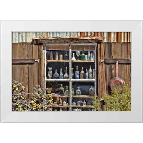 CA, Randsburg Bottles in window of a store White Modern Wood Framed Art Print by Paulson, Don
