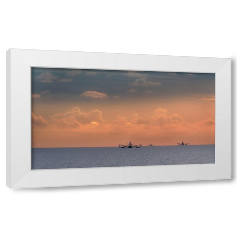 Fishing boats deep out to sea against the backdrop of dramatic sunset clouds and sky White Modern Wood Framed Art Print by Haddad, Sheila