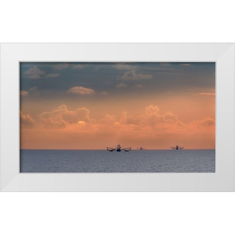 Fishing boats deep out to sea against the backdrop of dramatic sunset clouds and sky White Modern Wood Framed Art Print by Haddad, Sheila