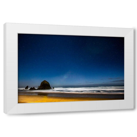 USA- Oregon. Cannon Beach and Haystack Rock stars showing during blue light. White Modern Wood Framed Art Print by Gulin, Darrell