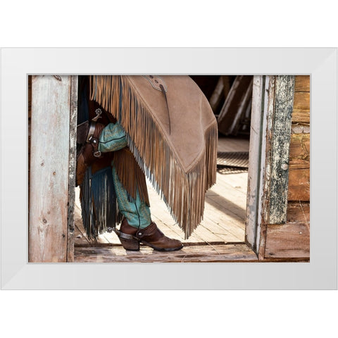 USA- Shell- Wyoming. Hideout Ranch cowgirl standing in doorway with cowboy boots and chaps.  White Modern Wood Framed Art Print by Gulin, Darrell
