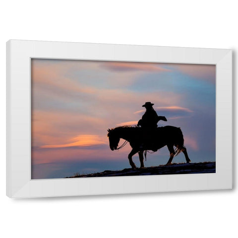 USA- Shell- Wyoming. Hideout Ranch cowgirl silhouetted on horseback at sunset.  White Modern Wood Framed Art Print by Gulin, Darrell