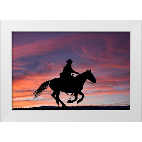 USA- Shell- Wyoming. Hideout Ranch cowgirl silhouetted on horseback at sunset.  White Modern Wood Framed Art Print by Gulin, Darrell