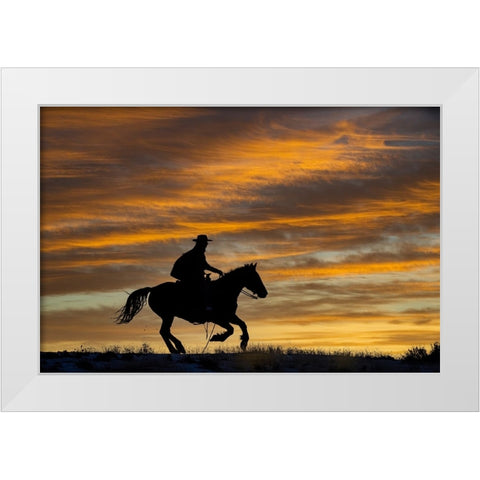 USA- Shell- Wyoming. Hideout Ranch cowgirl silhouetted on horseback at sunset.  White Modern Wood Framed Art Print by Gulin, Darrell