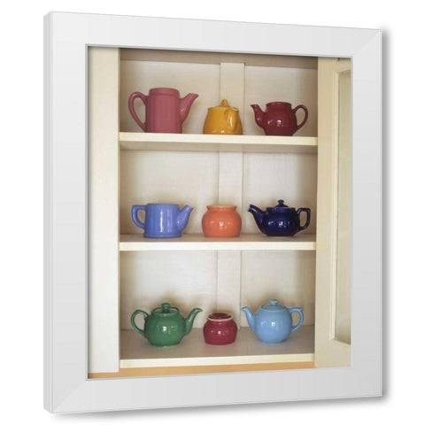 Antique ceramic teapots and sugar bowls in cupboard White Modern Wood Framed Art Print by Terrill, Steve