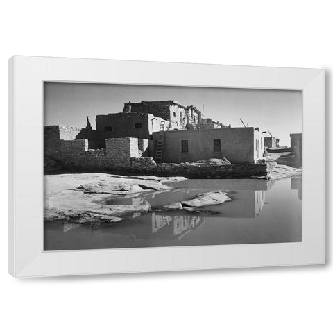 Adobe House with Water in Foreground - Acoma Pueblo, New Mexico - National Parks and Monuments, ca.  White Modern Wood Framed Art Print by Adams, Ansel