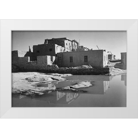 Adobe House with Water in Foreground - Acoma Pueblo, New Mexico - National Parks and Monuments, ca.  White Modern Wood Framed Art Print by Adams, Ansel
