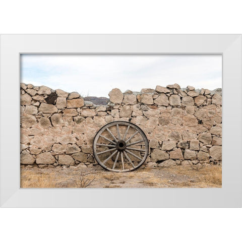 Wagon wheel against a stone fence at Hueco Tanks State Park, northwest of El Paso, TX White Modern Wood Framed Art Print by Highmith, Carol